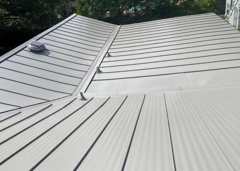 Solar attic fan installed on a metal roof for Roof Ventilation in Sun Lakes